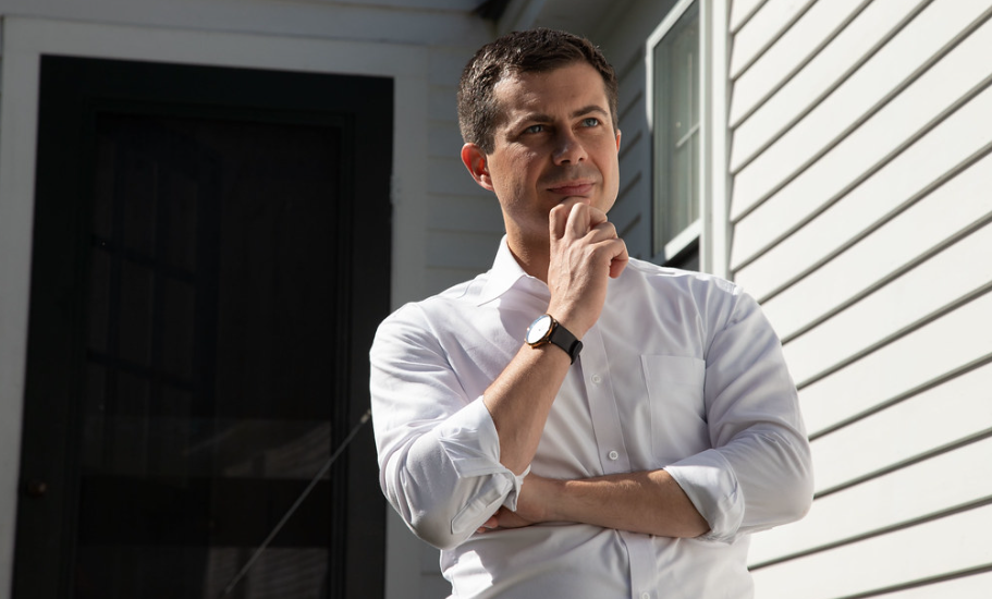 Pete Buttigieg outside with his hand on his chin